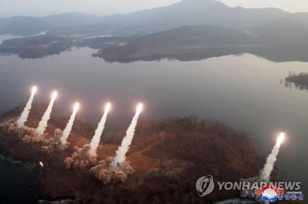 This photo, released by North Korea's official Korean Central News Agency on March 10, 2023, shows what appears to be tactical guided missiles being launched the previous day. North Korean leader Kim Jong-un inspected the 