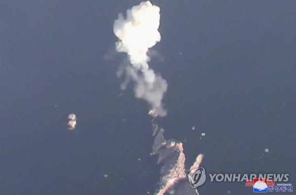 This photo, carried by the official Korean Central News Agency on March 28, 2023, shows the North co<em></em>nducting a demo<em></em>nstration education firing drill simulating tactical nuclear attacks involving the midair deto<em></em>nation of mock nuclear warheads. (For Use o<em></em>nly in the Republic of Korea. No Redistribution) (Yonhap)