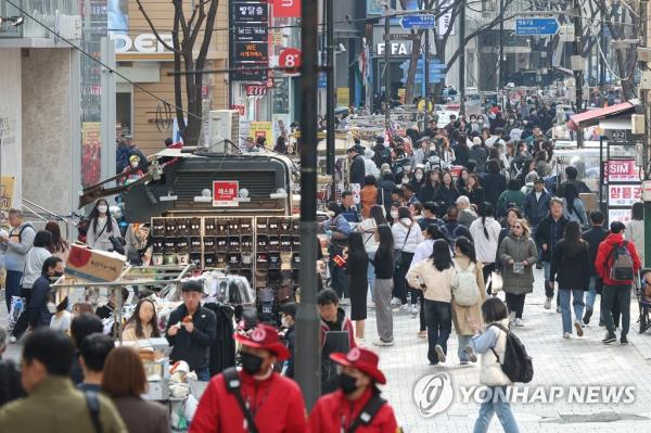 This photo, taken March 28, 2023, shows a vibrant Myeo<em></em>ngdong district in central Seoul, a scene restored after a period of desolation due to the COVID-19 outbreak. (Yonhap) 