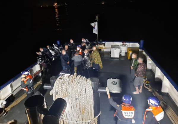 This photo provided by the Coast Guard shows rescued Russians on April 21, 2023. (PHOTO NOT FOR SALE) (Yonhap)