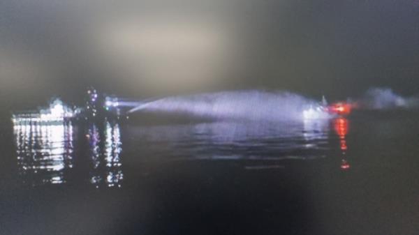 An operation is under way to put out a fire on a Russian fishing ship on April 21, 2023, in this photo provided by the Coast Guard. (PHOTO NOT FOR SALE) (Yonhap)