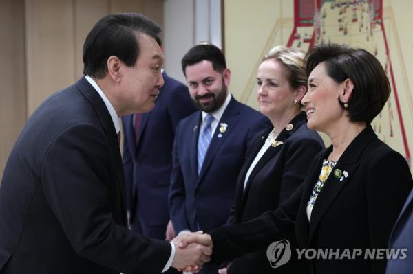President Yoon Suk Yeol (L) shakes hands with Young Kim (R-CA), the chairwoman of the U.S. House Foreign Affairs Subcommittee on the Indo-Pacific, in his office in Seoul on April 5, 2023, in this file photo provided by the presidential office. (PHOTO NOT FOR SALE) (Yonhap)