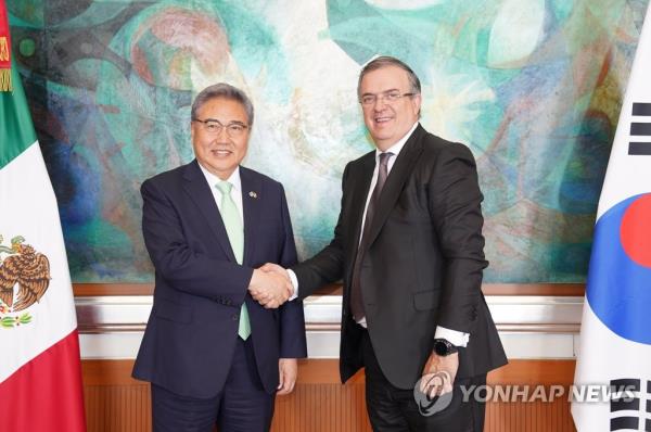 South Korea's Foreign Minister Park Jin (L) poses for a photo with his Mexican counterpart, Marcelo Ebrard, during their meeting in Mexico City on May 9, 2023, in this photo released by the South Korean ministry. (PHOTO NOT FOR SALE) (Yonhap)