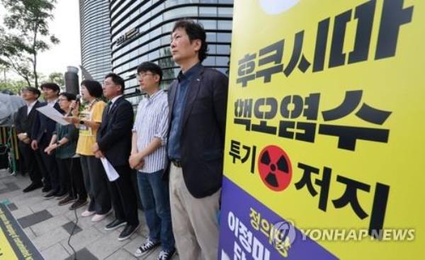 Lee Jeong-mi (C), leader of the progressive minor opposition Justice Party, speaks as she stages a hunger strike in front of the Japanese Embassy in Seoul on July 3, 2023, to protest Japan's plan to discharge radioactive water from the crippled Fukushima nuclear power plant into the ocean. (Yonhap)
