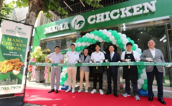 Mama Chicken, the first store of Papa John's Korea's fried chicken brand, celebrates its opening in western Seoul on July 21, 2023, in this photo provided by the company. (PHOTO NOT FOR SALE) (Yonhap)
