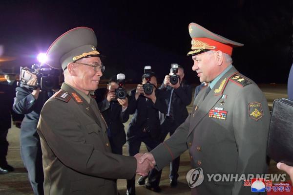 Russian Defense Minister Sergei Shoigu (R) shakes hands with North Korean Defense Minister Kang Sun-nam after arriving in Pyo<em></em>ngyang on July 25, 2023, in this photo released by the North's Korean Central News Agency. (For Use o<em></em>nly in the Republic of Korea. No Redistribution) (Yonhap)
