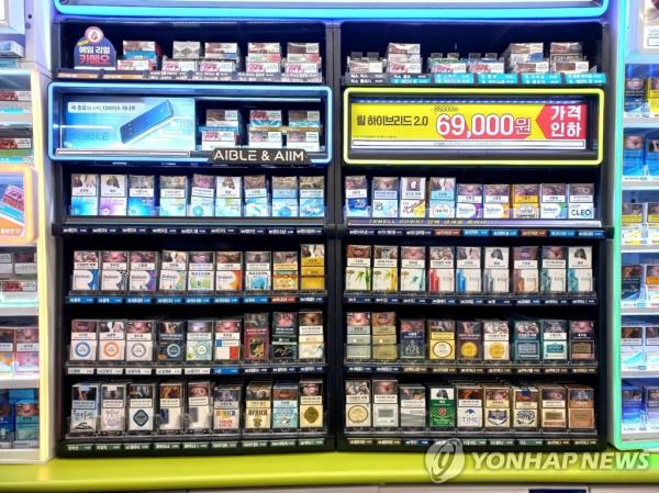 This undated file photo shows cigarette packs displayed at a store. (Yonhap)