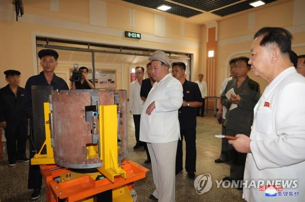This photo, captured from the website of the North's Korean Central News Agency on Aug. 6, 2023, shows North Korean leader Kim Jong-un giving field guidance at an arms factory. (For Use o<em></em>nly in the Republic of Korea. No Redistribution) (Yonhap)