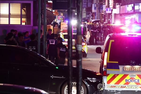 Police restrict access to a residential area in northwestern Seoul on Aug. 26, 2023, after a standoff with a man carrying weapons in the area. (Yonhap)