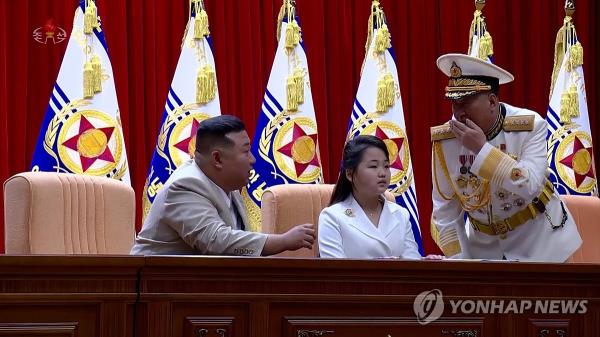This image, captured from footage of North Korea's state-run Korean Central Television on Aug. 29, 2023, shows North Korean leader Kim Jong-un (L) and his daughter, believed to be named Ju-ae, visiting the country's naval command two days earlier to celebrate Navy Day, which fell on Aug. 28. (For Use o<em></em>nly in the Republic of Korea. No Redistribution) (Yonhap)