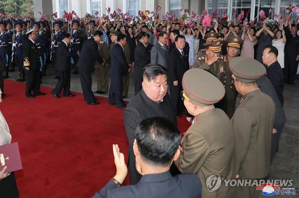 This photo, carried by North Korea's official Korean Central News Agency on Sept. 12, 2023, shows the North's leader Kim Jong-un (C) talking to officials ahead of a trip to Russia. (For Use o<em></em>nly in the Republic of Korea. No Redistribution) (Yonhap)