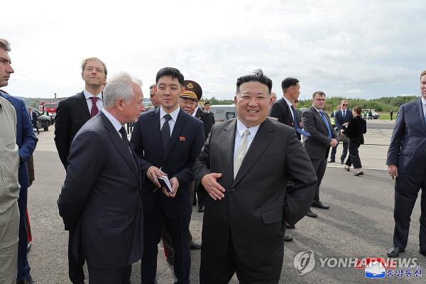 North Korean leader Kim Jong-un (C) smiles as he visits the Yuri Gagarin Aviation Plant in Komsomolsk-on-Amur, Russia on Sept. 15, 2023, in this photo released by the North's official Korean Central News Agency the next day. (For Use o<em></em>nly in the Republic of Korea. No Redistribution) (Yonhap) 
