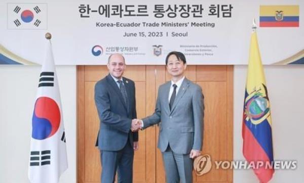 This photo, provided by South Korea's industry ministry, shows Trade Minister Ahn Duk-geun (R) shaking hands with his Ecuadorian counterpart, Julio Jose Prado, ahead of their talks in Seoul on June 15, 2023. (PHOTO NOT FOR SALE) (Yonhap)