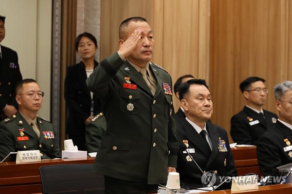 Marine Corps Commandant Lt. Gen. Kim Gye-hwan gives a military salute during a parliamentary audit held at the Navy's headquarters in Gyeryong, 142 kilometers south of Seoul, on Oct. 24, 2023. (Yonhap)