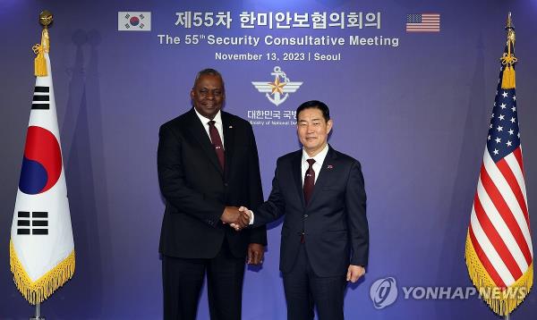 Defense Minister Shin Won-sik (R) and U.S. Secretary of Defense Lloyd Austin shakes hands ahead of the 55th Security Co<em></em>nsultative Meeting held at the defense ministry's headquarters in Seoul on Nov. 13, 2023, in this photo provided by the ministry. (PHOTO NOT FOR SALE) (Yonhap)