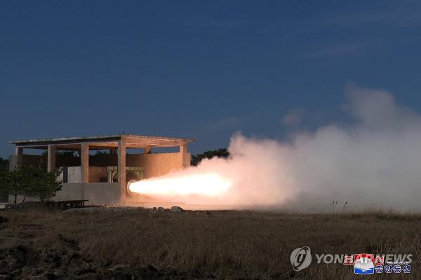 North Korea co<em></em>nducts ground jet tests of a new type of high-thrust solid-fuel engines for intermediate-range ballistic missiles, in this photo carried by the Korean Central News Agency on Nov. 15, 2023. (For Use o<em></em>nly in the Republic of Korea. No Redistribution) (Yonhap)