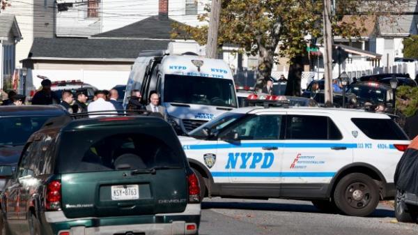 Dozens of NYPD officers from 113th Precinct and beyond flock to Milburn Street near 122nd Avenue in Queens after a unidentified man, accordingly to Cops the landlord walked into their Precinct saying something bad had happened at house located at 122-39 Milburn Street, respo<em></em>nding officers found three victims at the location stabbed to death early Tuesday November 14, 2023. (Luiz C. Ribeiro for NY Daily News)