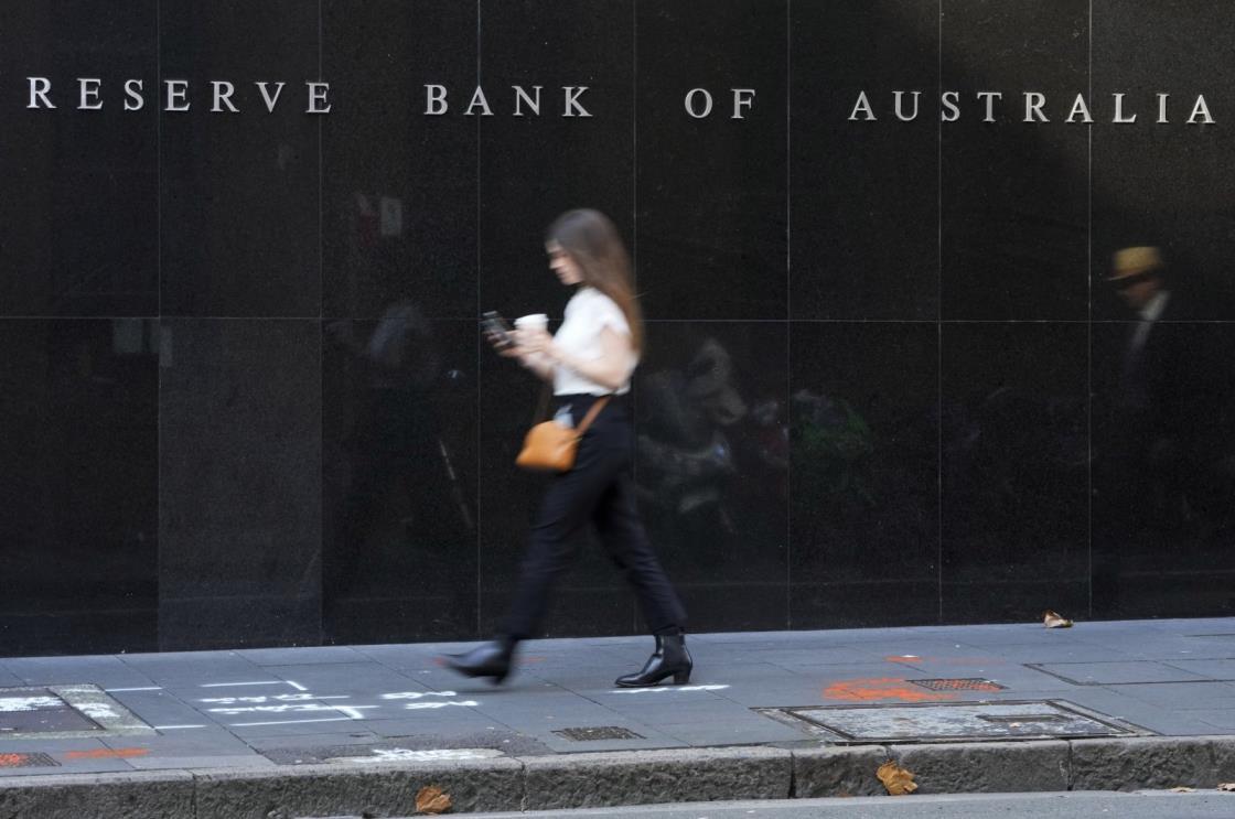 A woman walks past the outside of the Reserve Bank of Australia, in Sydney, Australia, May 3, 2022. (AP Photo)