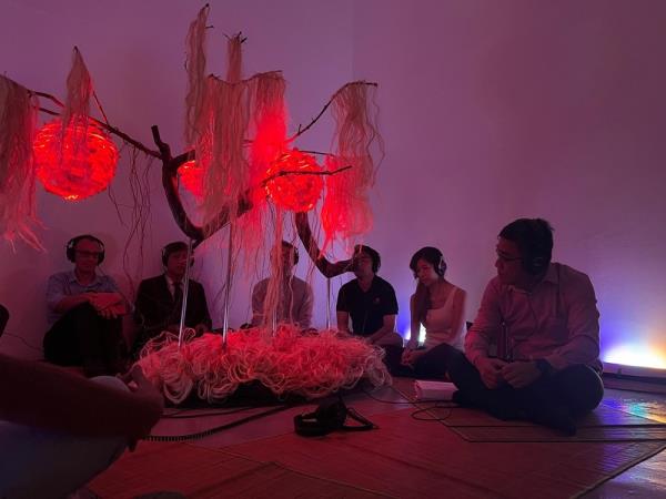 Visitors are invited to sit around the Tree of Light as they listen to the story of the tree. — Picture courtesy of Penang Art District 