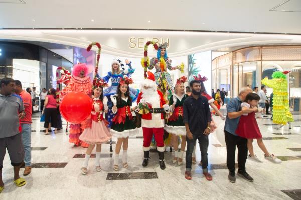 A Christmas parade, featuring Santa Claus and his elves, will take place every weekend until Christmas at the main entrance. — Picture by Raymond Manuel