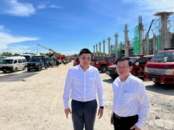 Collapsed beams hampering recovery of four workers trapped below under-co<em></em>nstruction Penang building